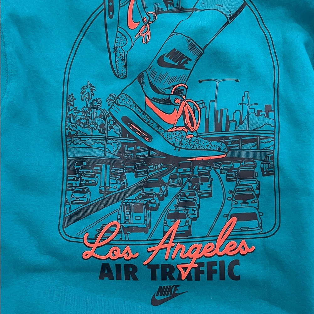 Nike Teal Hoodie with Graphic Design